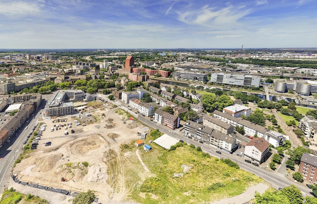 Luftaufnahme des Mercatorviertels mit Straßen und Bauprojekten.