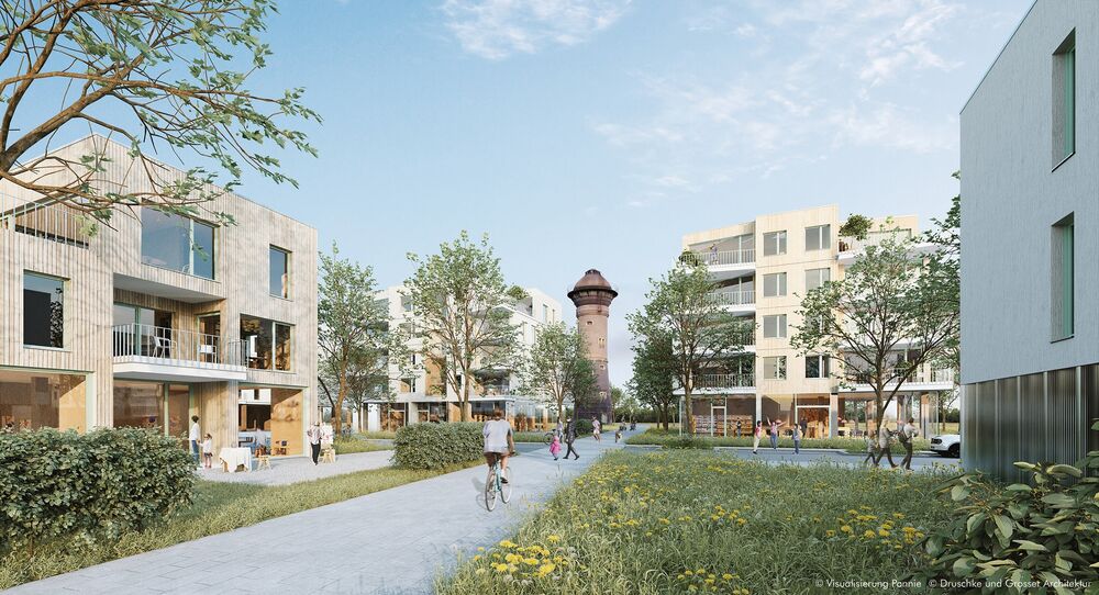 Visualisierung des Quartiers Am Wasserturm in Wedau: Zwei- bis viergeschossige, teils holzverkleidete Häuser, dazwischen Blumenwiesen und Gehwege. Menschen sind unterwegs, im Hintergrund ragt der Wasserturm empor.